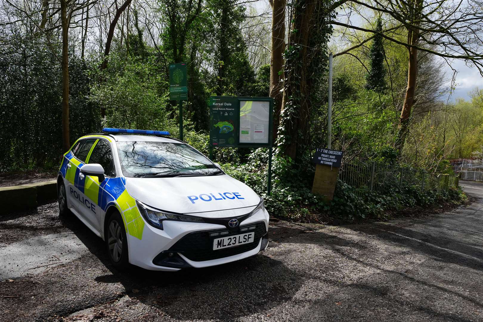 A police car parked at the entrance to Kersal Dale, near Salford, Greater Manchester (Peter Byrne/PA)